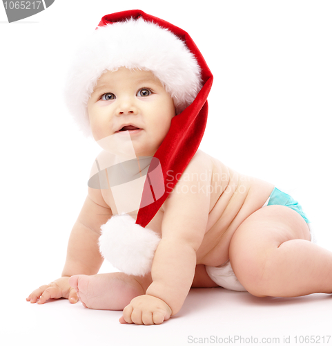 Image of Little child wearing red Christmas cap