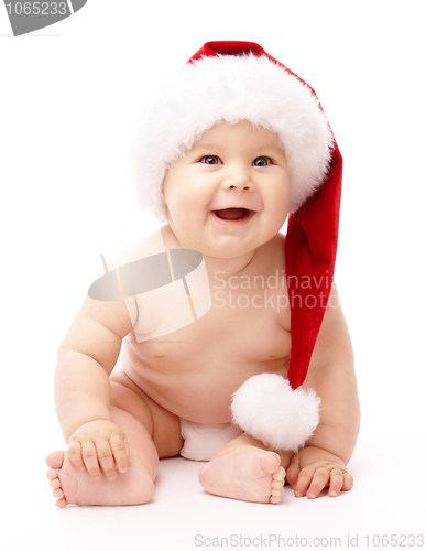 Image of Little child wearing red Christmas cap