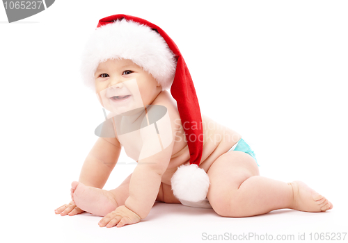 Image of Little child wearing red Christmas cap