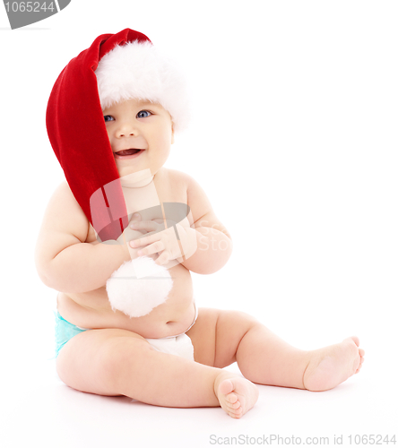 Image of Little child wearing red Christmas cap