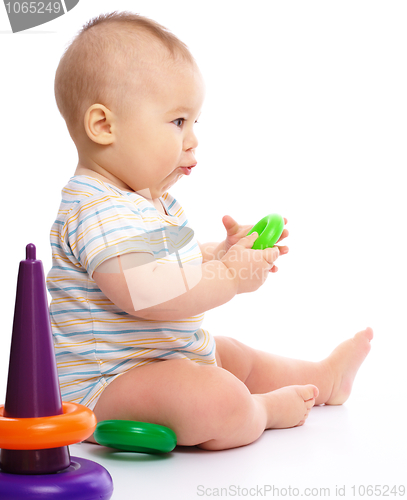 Image of Little boy play with toys