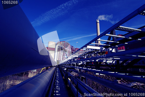 Image of Industrial zone, Steel pipelines and valves against blue sky