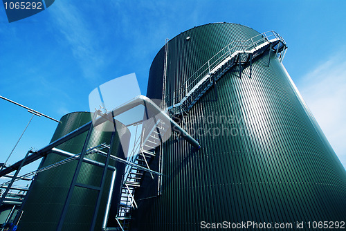 Image of Industrial zone, Steel pipelines and valves against blue sky