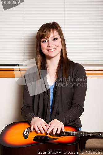 Image of Teenager with guitar