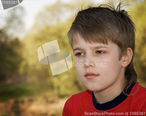 Image of teenager in red t-shirt