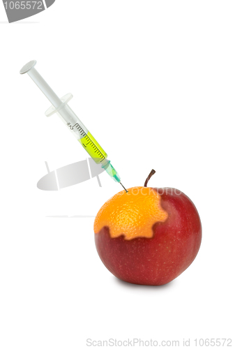 Image of GMO: apple being mutated into the orange after injection of unknown green liquid