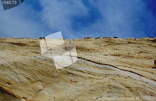 Image of rock  with blue sky and clouds