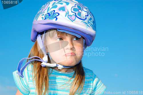 Image of grimacing girl with a helmet