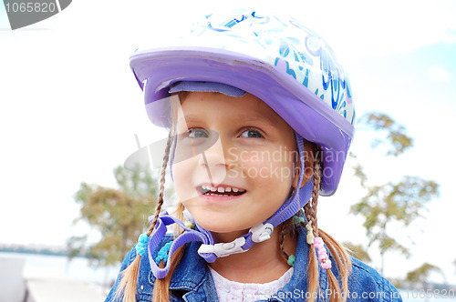 Image of happy girl wearing a helmet
