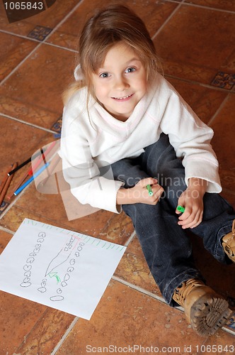 Image of little girl drawing a house