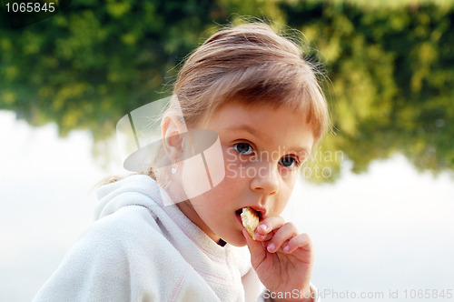 Image of child eating outdoor