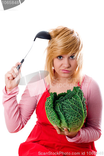 Image of woman with fresh savoy cabbage and ladle