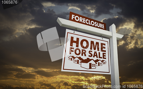Image of White Foreclosure Home For Sale Real Estate Sign Over Sunset Sky