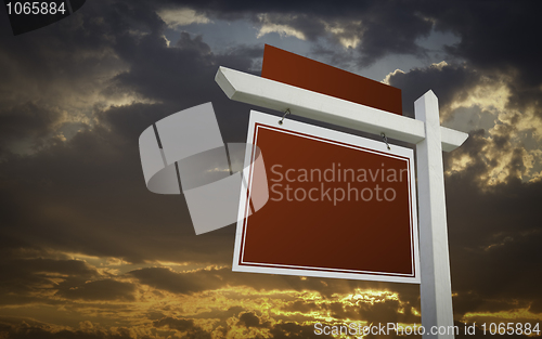 Image of Blank Red Real Estate Sign Over Sunset Sky