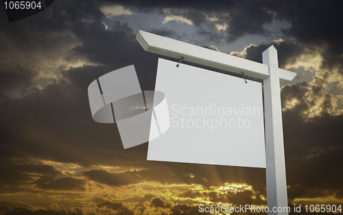 Image of Blank White Real Estate Sign Over Sunset Sky