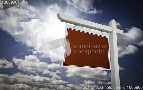 Image of Blank Red Real Estate Sign Over Sky