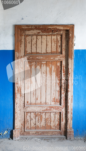 Image of The closed old decayed door