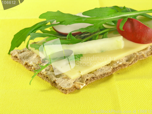 Image of  crispy bread  with rucola and radish