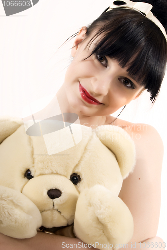 Image of Young woman with teddy bear  