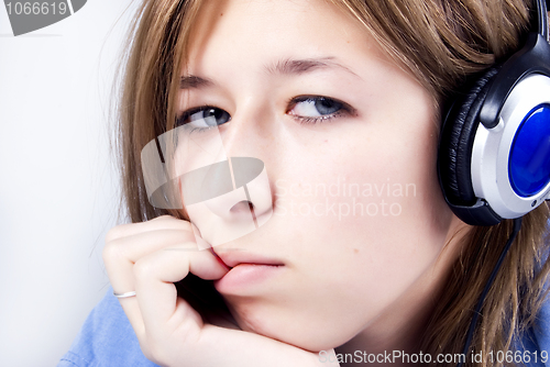 Image of Young girl in headphones   
