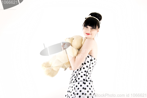Image of Young woman with teddy bear 