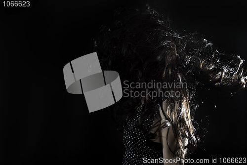 Image of young girl  with long curly hair