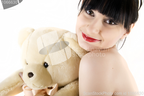 Image of Young woman with teddy bear  