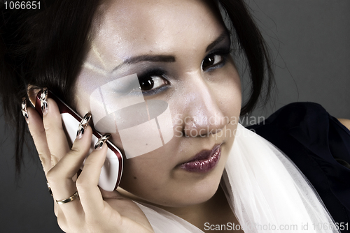 Image of Portrait of a young girl with the phone       