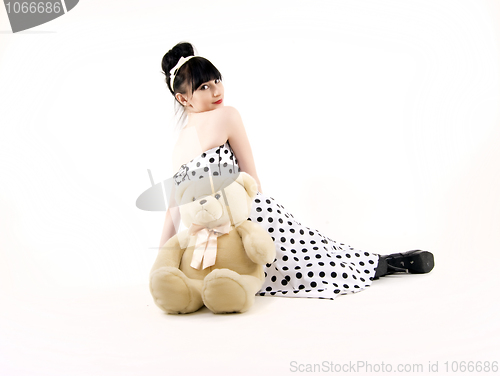 Image of Young woman with teddy bear 