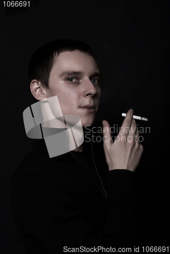 Image of portrait of a young man with cigarette  