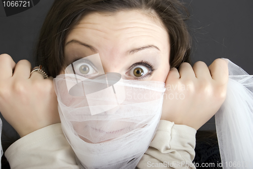 Image of young girl hiding her face