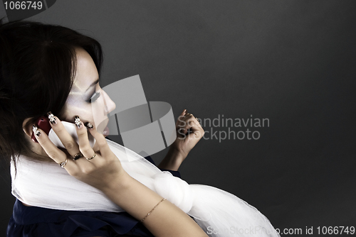 Image of Portrait of a young girl with the phone      