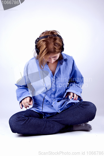 Image of Young girl in headphones   