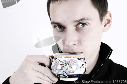 Image of young man with a cup of tea