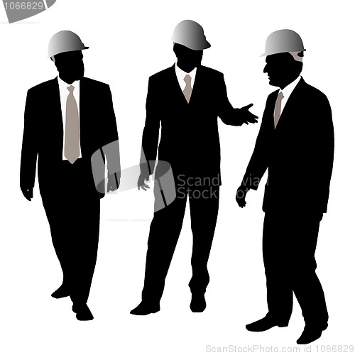 Image of Three businessmen architects or engineers with protective helmet