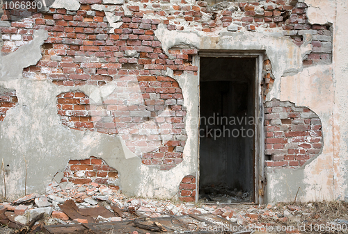 Image of Old red brick wall with door