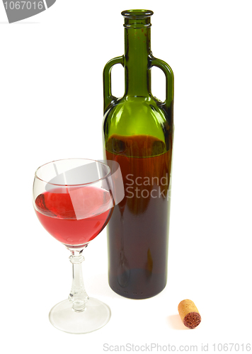 Image of Red wine bottle, glass and stopper