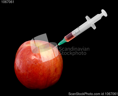 Image of Red apple with a syringe