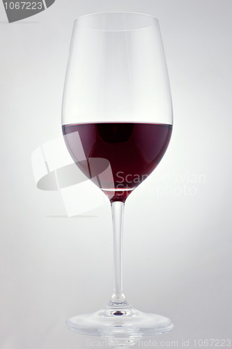 Image of Glass of red wine in soft white light