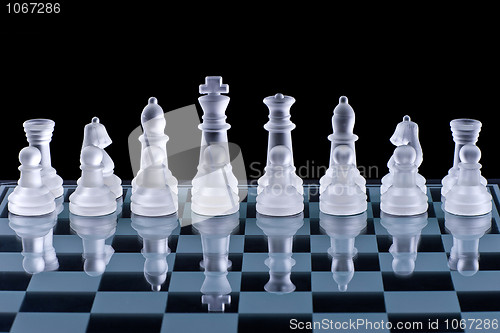 Image of Macro shot of glass chess set against a black background