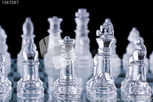 Image of Macro shot of glass chess set against a black background