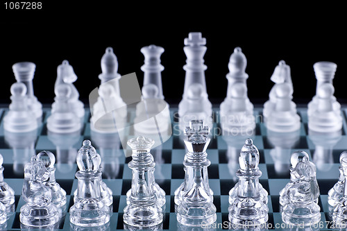 Image of Macro shot of glass chess set against a black background