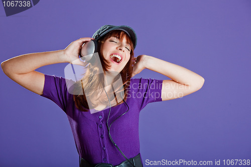 Image of Beautiful woman listening music