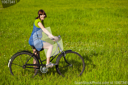 Image of Girl with a bicycle