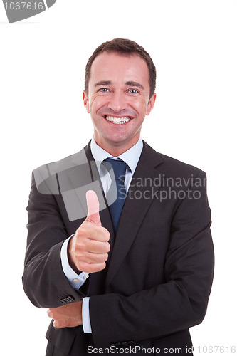 Image of handsome businessman with thumb raised as a sign of success