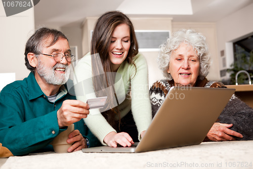 Image of Senior couple shopping online