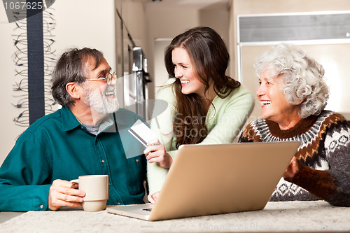 Image of Senior couple shopping online