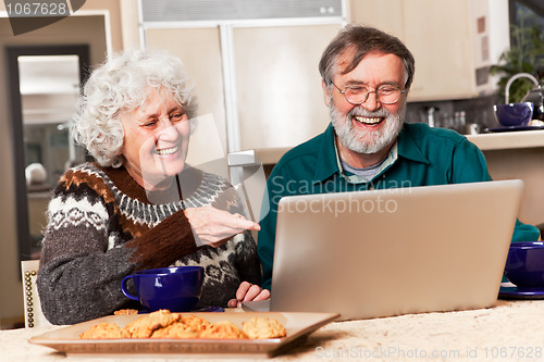Image of Senior couple using computer