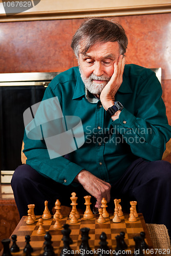 Image of Senior man playing chess