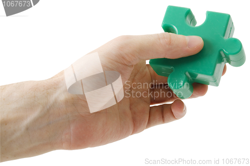 Image of Puzzle piece in hand